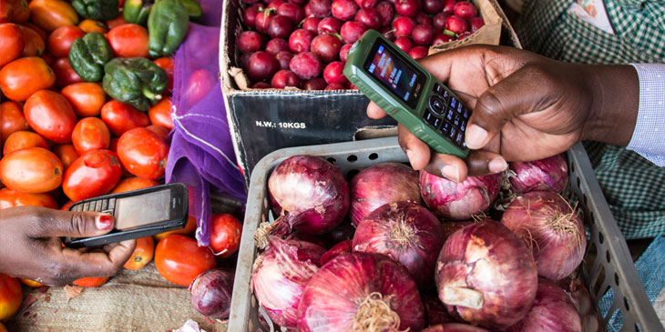 East African traders using mobile app