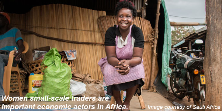 woman sitting on porch with trade goods image courtesy of Sauti Africa